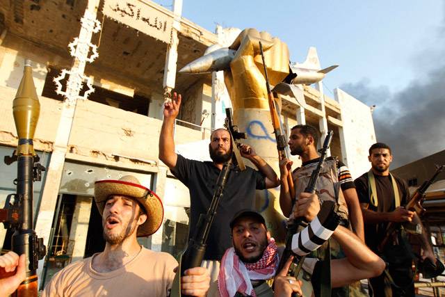 Libyan rebels celebrate at Bab Al-Aziziya compound in Tripoli
